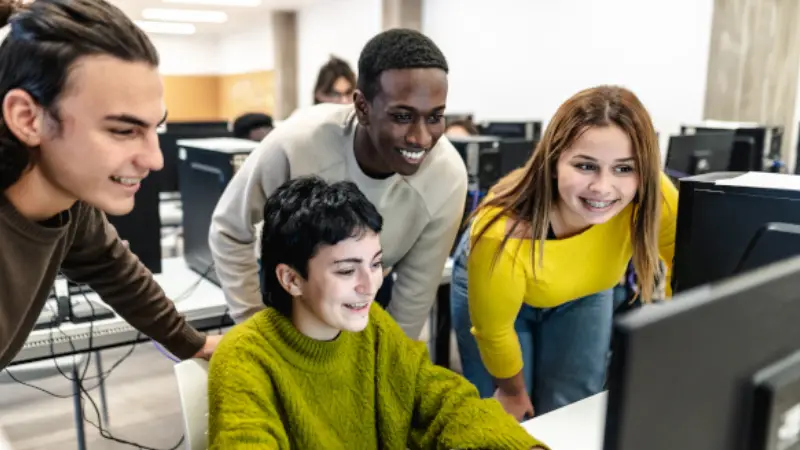 young-classmates-studying-together-inside-classroom young-classmates-studying-together-inside-classroom
